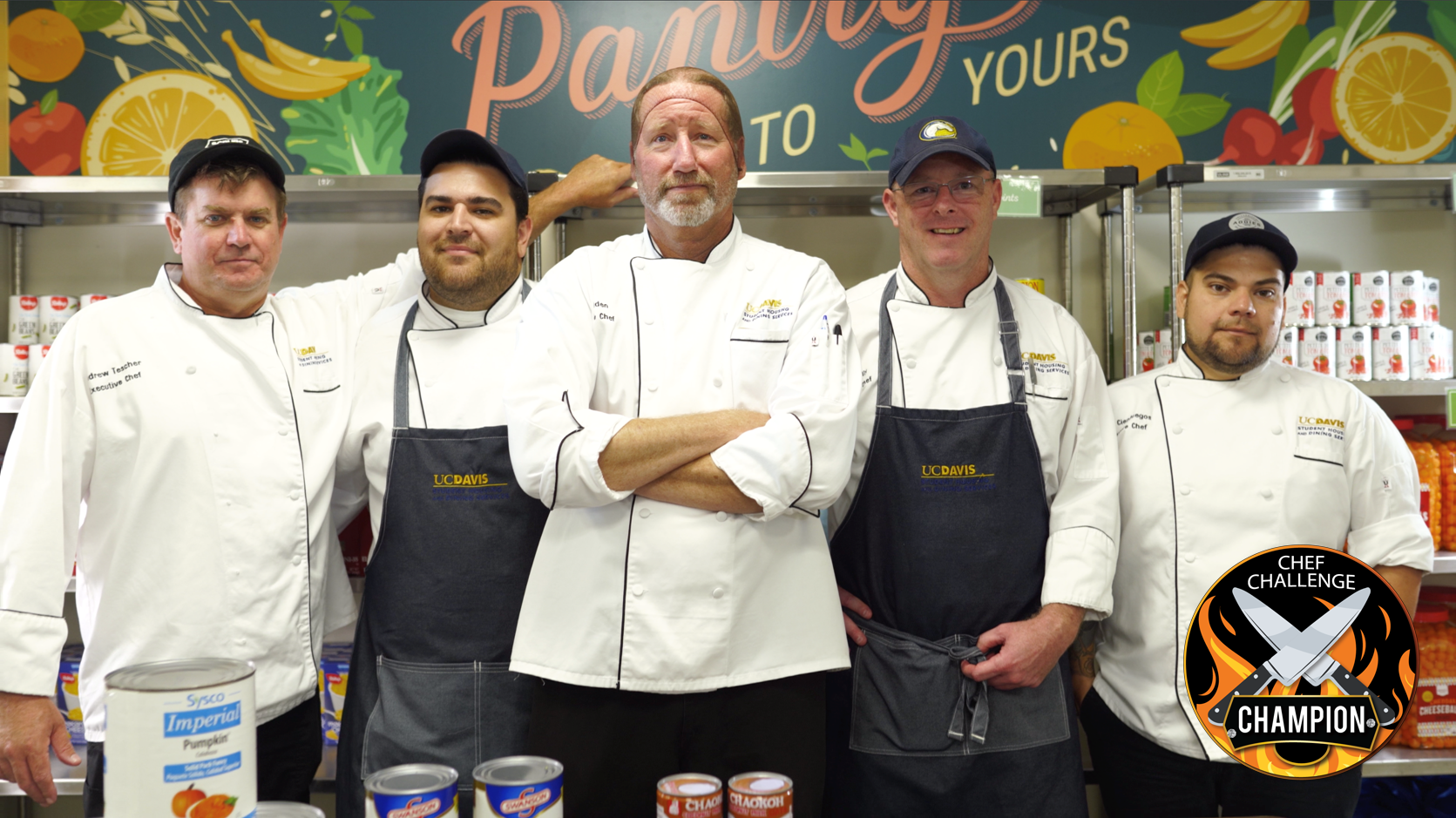 Group photo: the Chefs, standing together in the kitchen